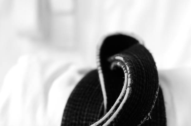 istock black belt martial arts on white background 826792886