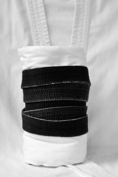 istock black belt martial arts on white background 826792926
