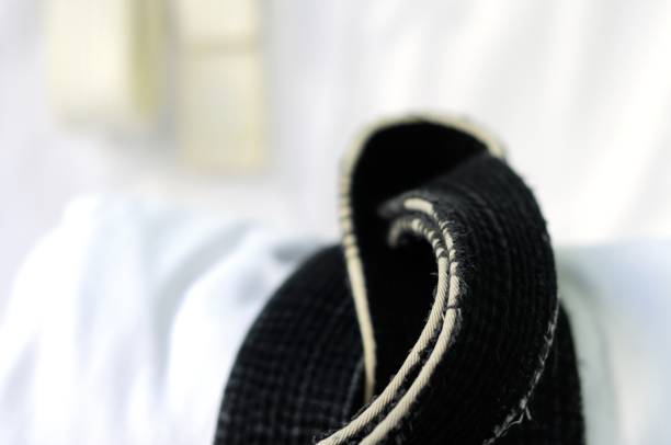 istock black belt martial arts on white background 826793132