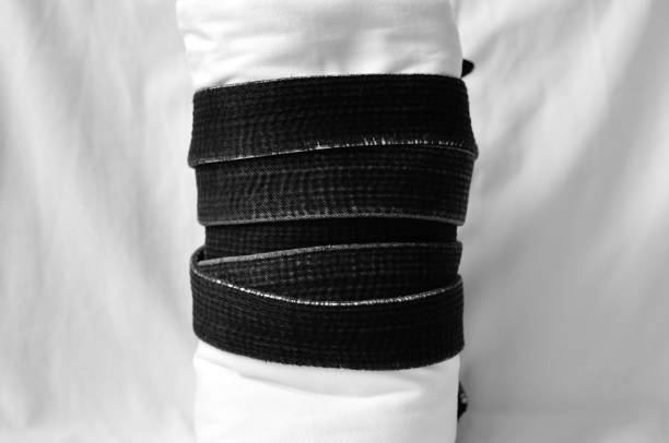 istock black belt martial arts on white background 826793214