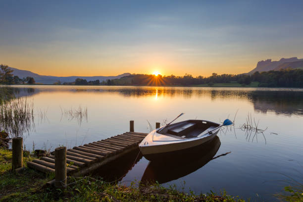 istock Reflection of sunrise on water 826795638