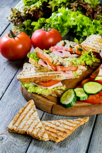 istock Panini sandwich with ham, tomato and lettuce. 826796032