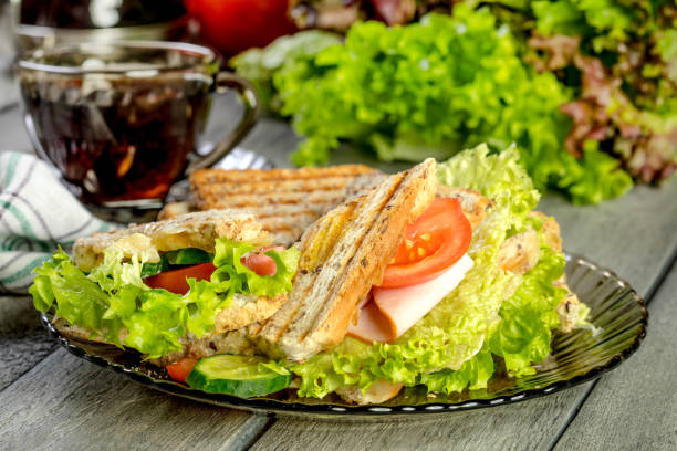istock Panini sandwich with ham, tomato and lettuce. 826799304