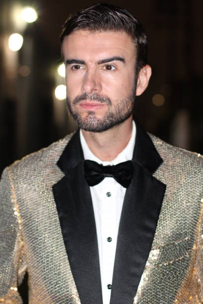 istock Posh man wearing a shiny outfit 826802860