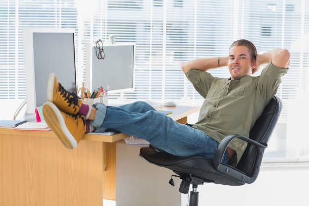 istock Designer relaxing with foot on the desk 826803710