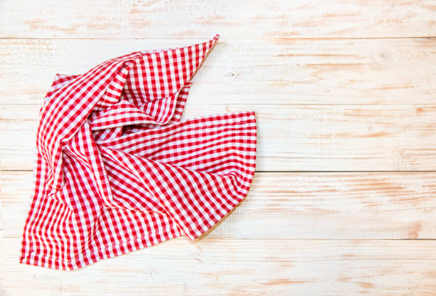 istock The checkered tablecloth on wooden table. 826812444
