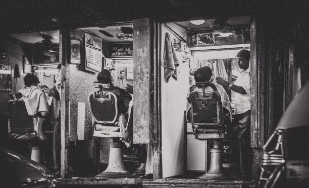 Open door barber shop along the streets of Mumbai. Mumbai is among the gems of India, for being an economic haven of its businesses and the home of the Indian film industry. Among the most overpopulated cities in the world, this place also holds among the highest numbers of the poor liv