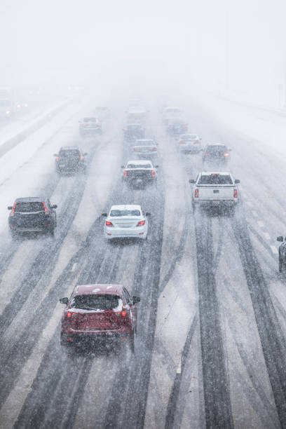 istock Cars driving on a snow covered road 826823286