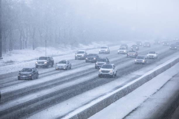 istock Cars driving on a snow covered road 826823296