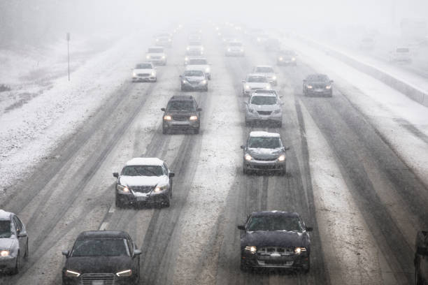 istock Cars driving on a snow covered road 826823328