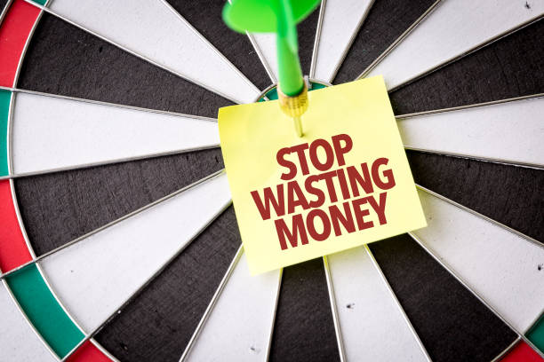 stop wasting money - money to burn fotos imagens e fotografias de stock