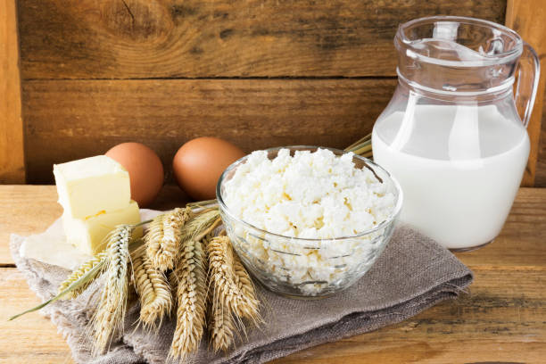 istock Organic products: eggs, milk, cottage cheese, butter, wheat on a wooden background. 826828106