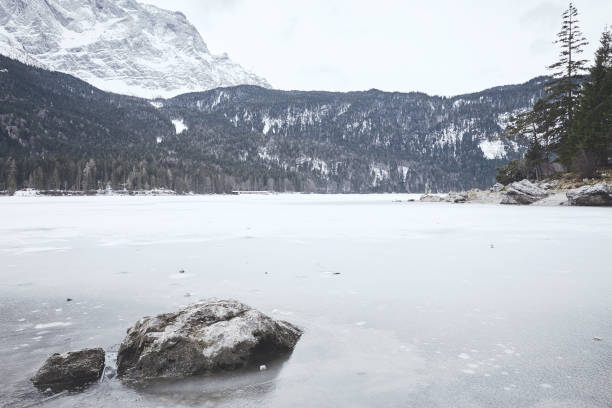 istock Tourist at winter mountain lake 826831062