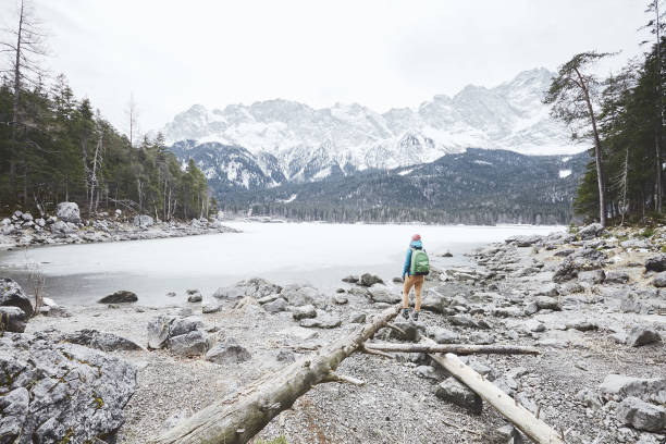 istock Tourist at winter mountain lake 826834408