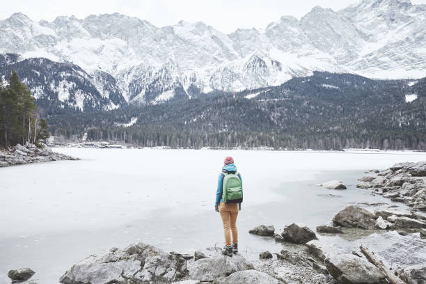 istock Tourist at winter mountain lake 826834412