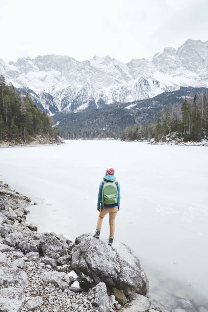 istock Tourist at winter mountain lake 826834446