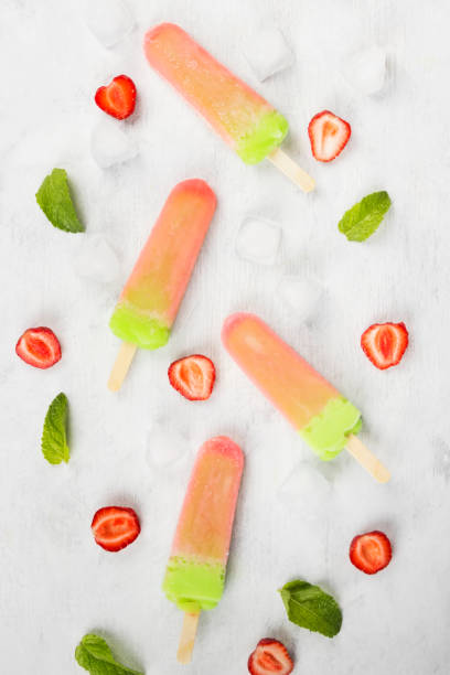 istock Multi-colored popsicles on a white background. Top view. Food background 826834492