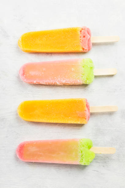 istock Multi-colored popsicles on a white background. Top view. Food background 826834494