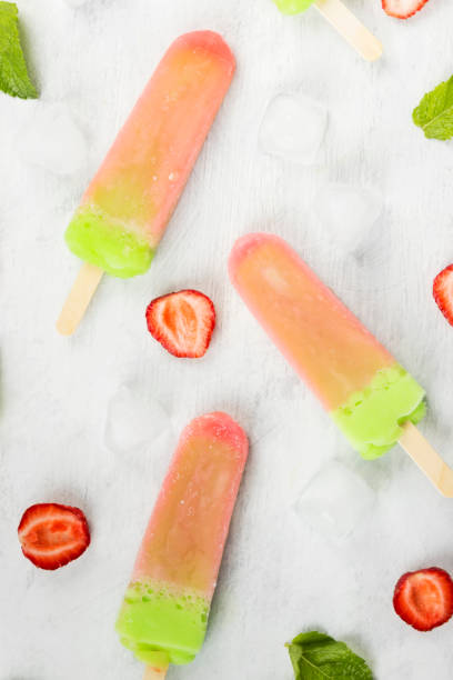 istock Multi-colored popsicles on a white background. Top view. Food background 826834500
