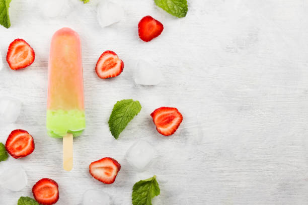 istock Multi-colored popsicles on a white background. Top view, copy space. Food background 826834518