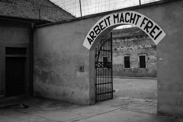 Work Power Free - Nazi's slogan Terezin: Arbeit Macht Frei (work liberates) - slogan in Terezin memorial, the former concentration camp. Thousands of Jew people were murdered in the concentration camp Small Fortress by Nazis during WW2. former czechoslovakia stock pictures, royalty-free photos & images