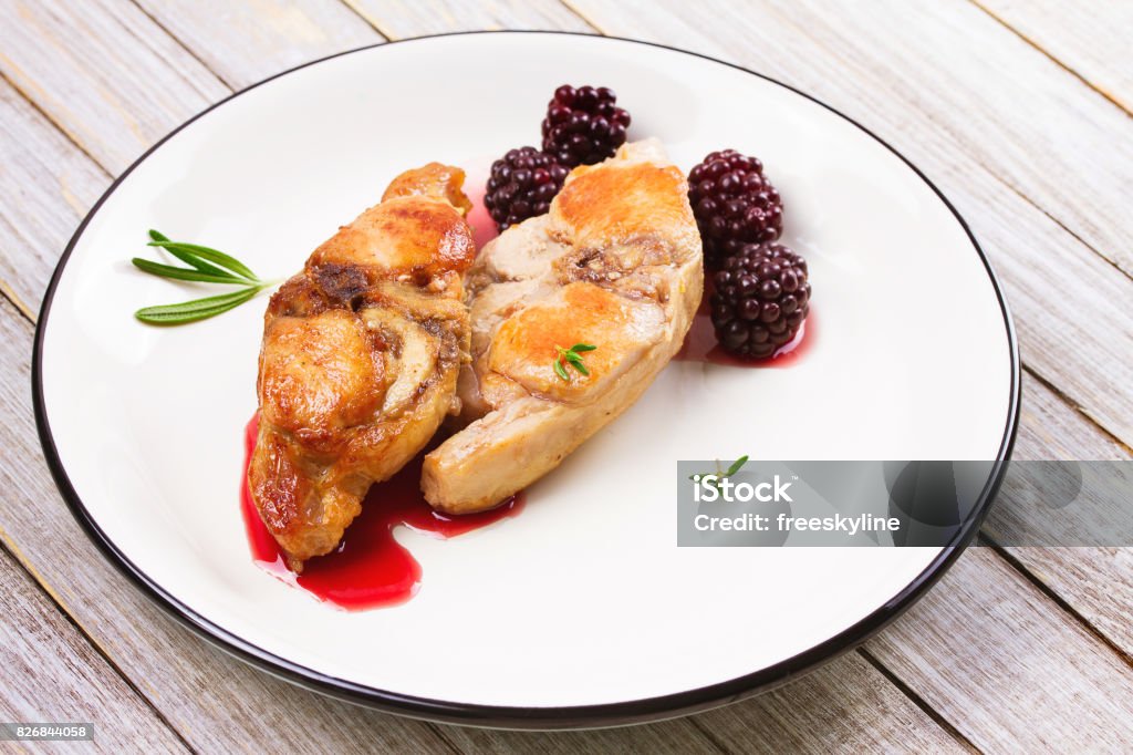 Rabbit in blackberry sauce with rosemary and thyme Back Stock Photo