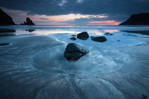 istock Black sands at Talisker Bay at sunset. 826844150