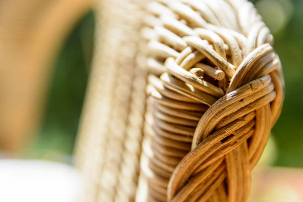Elegant comfortable wicker chair on white background