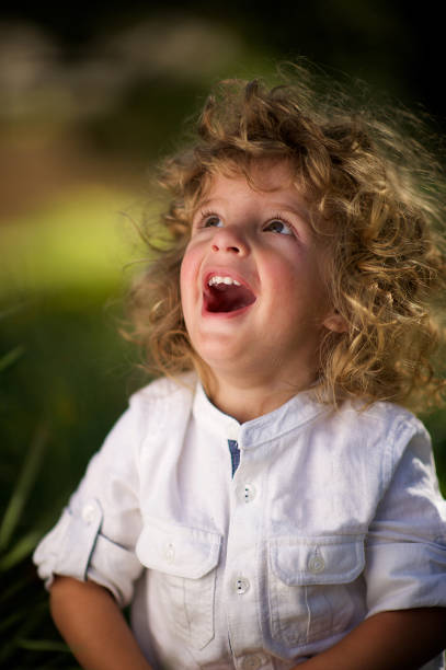 istock Portrait of cute boy looking up 826845312