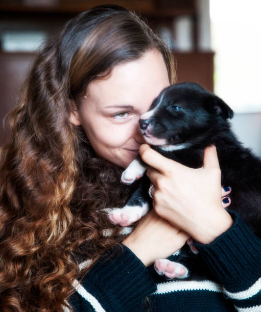 istock Young woman w small puppy. 826846734