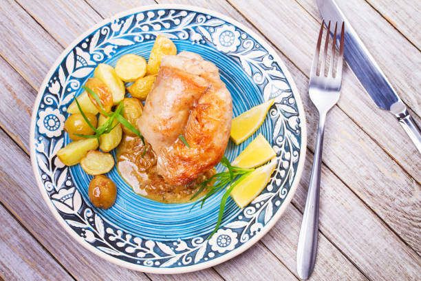 istock Rabbit with potatoes and lemon in cream sauce, garnished with tarragon 826846748