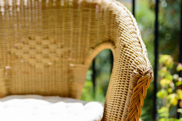 istock A rattan chair with a white cushion on a balcony 826847104