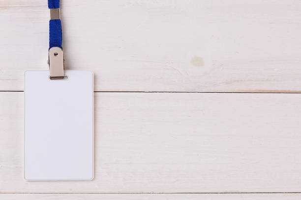 istock Blank Identification Card with Neckband on Wooden Background 826847152