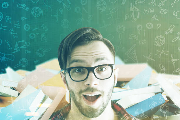 istock Surprised man in glasses and books in class toned 826854542