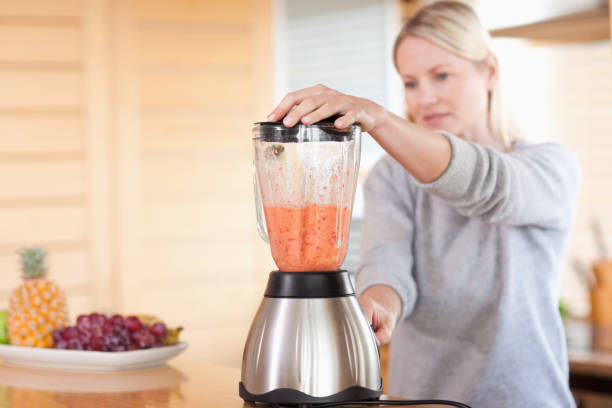istock Side view of blender chopping fruits 826854692