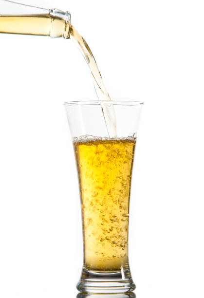 istock Glass of beer being poured from a bottle 826854966
