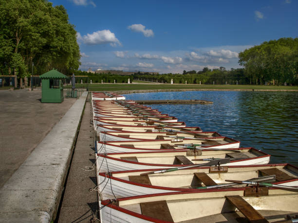 istock Boats in the row on a blue lake. 826860064