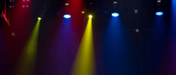 istock scene, stage light with colored spotlights and smoke 826862480