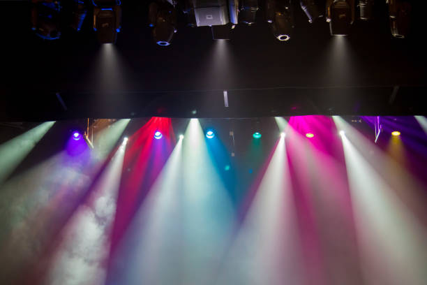 istock scene, stage light with colored spotlights and smoke 826862910