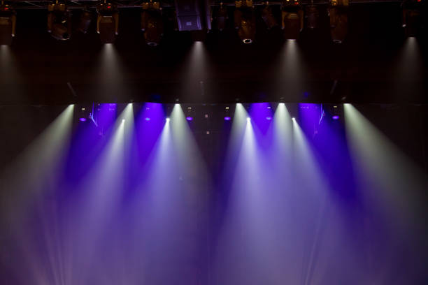 istock scene, stage light with colored spotlights and smoke 826864994
