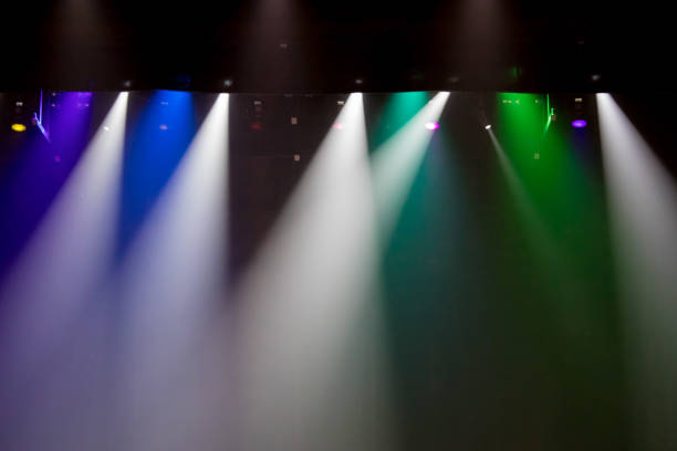 istock scene, stage light with colored spotlights and smoke 826865066