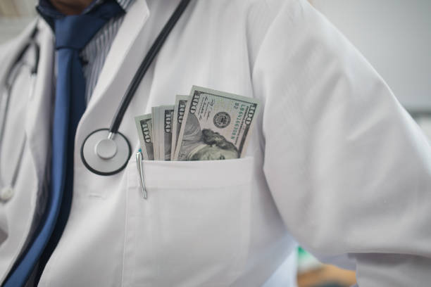 corruption in health care - currency stethoscope medicare usa imagens e fotografias de stock