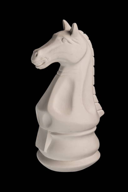 istock plaster figurine chess piece, horse, black background 826873372