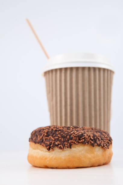 istock A doughnut and a cup of coffee placed together 826875848