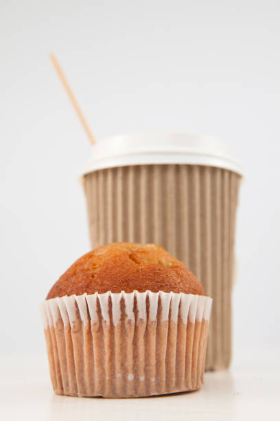 istock Muffin and cup of tea placed together 826875956