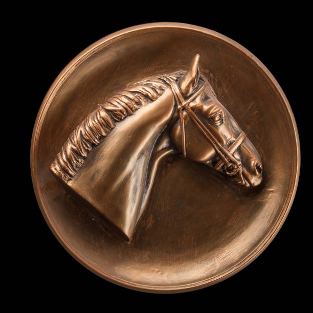 Bronze basrelief of a horse on a black background