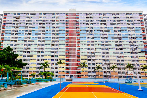 plOld Public Residential Estate in Hong Kong Choi Hung or literally "Rainbow Estate" is one of the oldest public housing estates in Hong Kong. Located in the Wong Tai Sin District of Kowloon, the old concrete apartments were built in the early 1960s. With a population of over 7 million, Hong Kong is one of the most densely populated areas in the world. chinese slum stock pictures, royalty-free photos & images