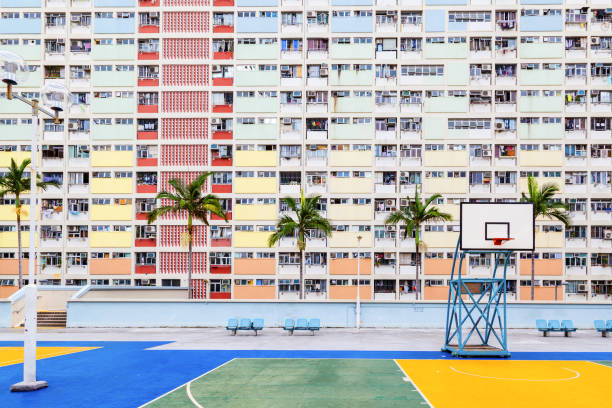 Old Public Residential Estate in Hong Kong Choi Hung or literally "Rainbow Estate" is one of the oldest public housing estates in Hong Kong. Located in the Wong Tai Sin District of Kowloon, the old concrete apartments were built in the early 1960s. With a population of over 7 million, Hong Kong is one of the most densely populated areas in the world. china slums stock pictures, royalty-free photos & images