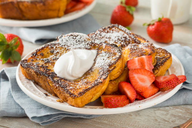 Gourmet Homemade Brioche French Toast Gourmet Homemade Brioche French Toast with Strawberries french toast stock pictures, royalty-free photos & images