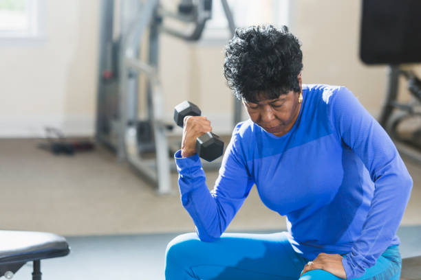 istock Mature black woman exercising at gym 826909252